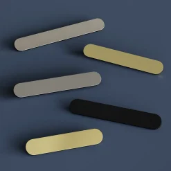 Poignée de meuble arrondi GoodHome Minzh aluminium effet laiton satin doré l.153mm x l.25mm x H. 16mm entraxe 128mm